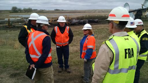 Sen. Heitkamp meets with officials at the site of the train derailment near Heimdal.
