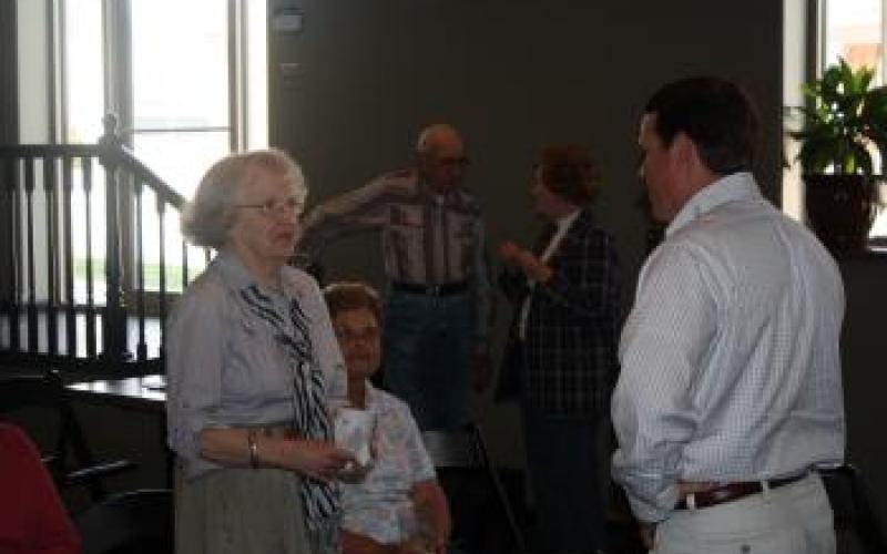 Congressman Graves speaks with constituents before a Meet and Greet at Wabash Junction in Stanberry