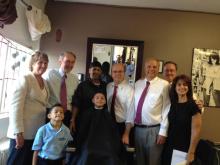 Senator Markey  with constituents in a barber shop in Worcester, MA
