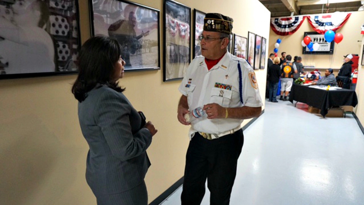 Rep. Torres speaks to a veteran during a veterans resource fair