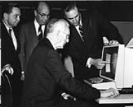 Speaker of the House John McCormack of Massachusetts examines new technology for the House in 1969.