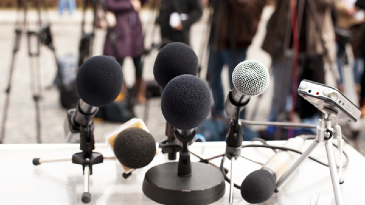 Microphones at a news conference
