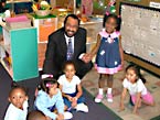 Congressman Al Green visits with students at a Head Start program located at the Sunnyside Multipurpose Center.