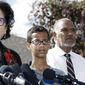 Ahmed Mohamed, 14, center, and his father Mohamed Elhassan Mohamed, right, look on as their attorney Linda Moreno, left, delivers a statement about the arrest of Ahmed during a news conference, Wednesday, September 16, 2015, in Irving, Texas. Ahmed was arrested after a teacher thought a homemade clock he built was a bomb. (AP Photo/Brandon Wade) ** FILE **
