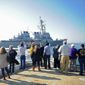 Families watch from a pier as the USS Mahan departs Naval Station Norfolk for a scheduled deployment on Nov. 19, 2016. (U.S. Navy)