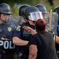 Two-thirds of officers say protesters who fill American streets in the wake of police shootings are motivated by anti-police bias rather than a desire to hold officers accountable for their actions. (Associated Press)