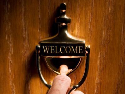 welcome sign on an office doorknocker