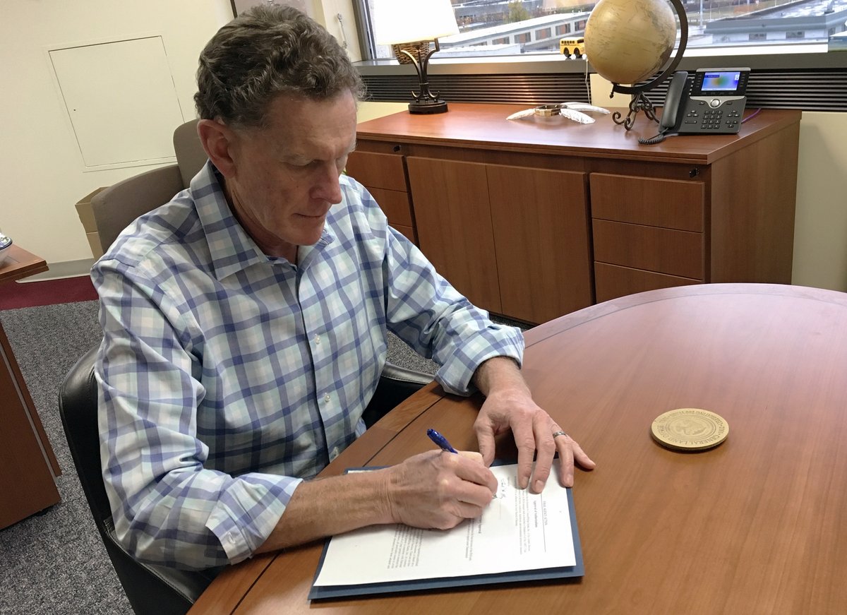 Acting Alaska State Director, Ted Murphy signing the GMT2 Joint Record of Decision in his office