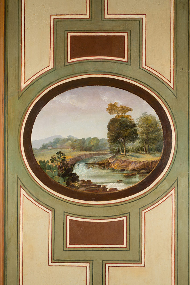An oval medallion of landscape painted in the Brumidi Corridors.
