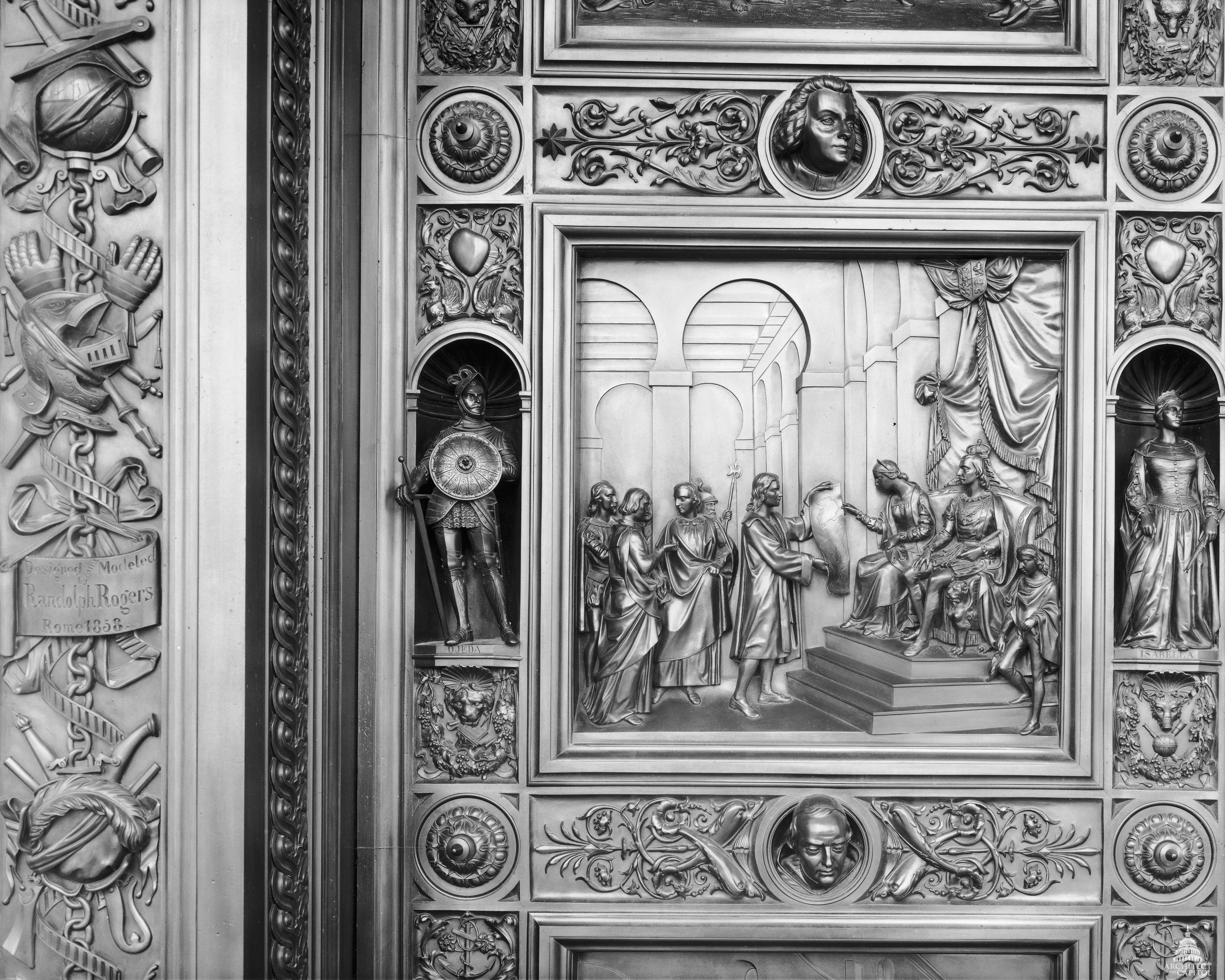 This panel of the Columbus Doors depicts Queen Isabella listening attentively to Columbus's explanation of his map, with King Ferdinand at her side.