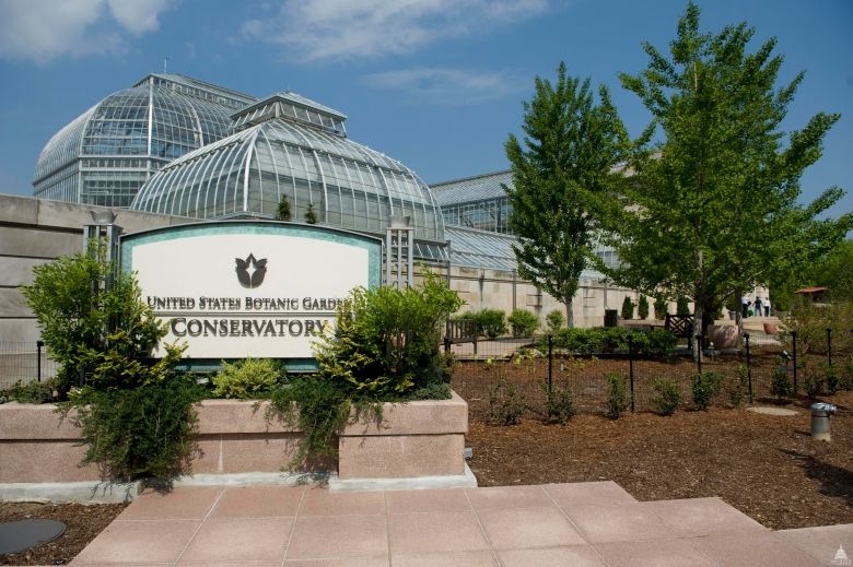 Outside view of the U.S. Botanic Garden Conservatory and sign.