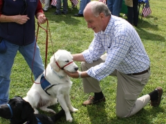 Congressman Keating petting a dog.