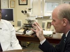 Congressman Keating talking to a doctor.