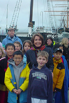 Pelosi joins schoolchildren at the C.A. Thayer before it departed for restoration in December 2003.