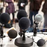 Microphones at a news conference