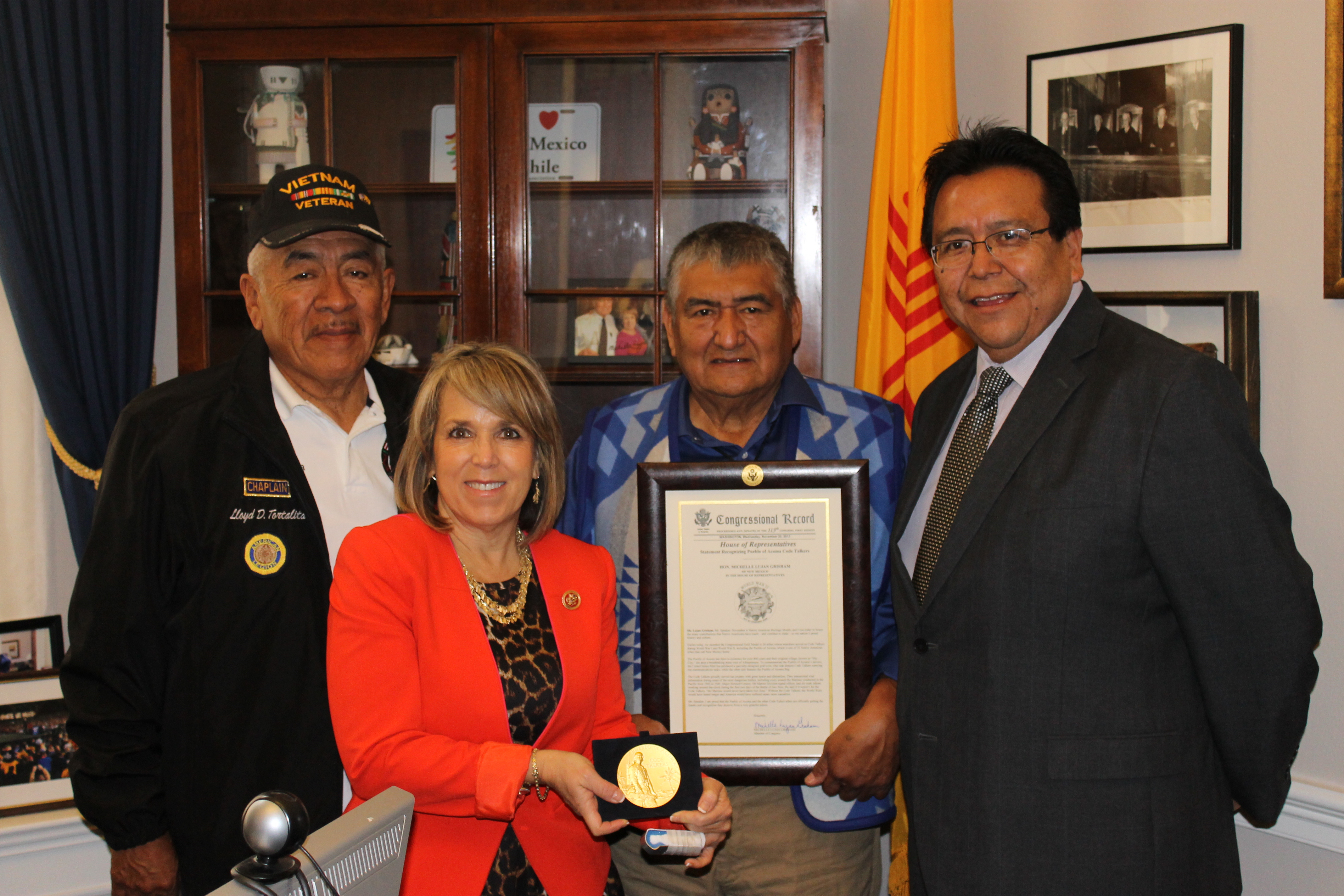Congresswoman Lujan Grisham presented Pueblo of Acoma Governor Gregg P. Shutiva and other Acoma leaders with a statement she submitted to the Congressional Record honoring the Acoma members who served as  Code Talkers during World War I and II.