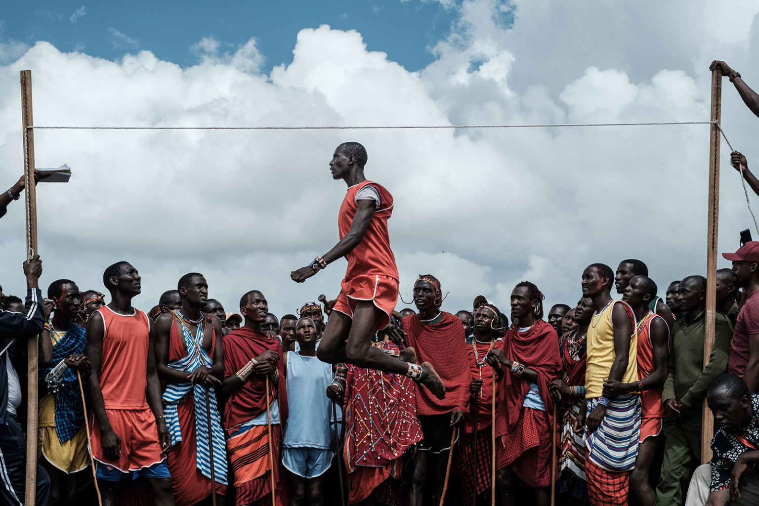 A Maasai warrior jumps to reach a rope during a sporting event dubbed the Maasai Olympics at Kimana, near Kenya's bordertown with Tanzania, on Dec. 15. The event, held every two years since 2012, is an initiative of international conservation groups to offer Maasai warriors an alternative to killing lions as part of their traditional rite of passage.  YASUYOSHI CHIBA/AFP/Getty Images