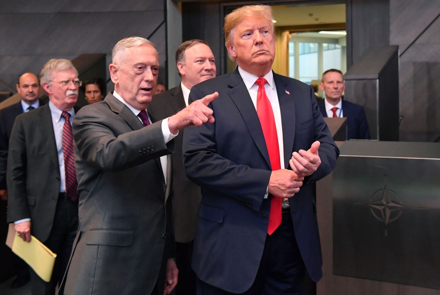 President Donald Trump walks with Secretary of Defence James Mattis, Secretary of State Mike Pompeo, and National Security Adviser John Bolton at the NATO headquarters in Brussels, on July 11. (Emmanuel Dunand/AFP/Getty Images)