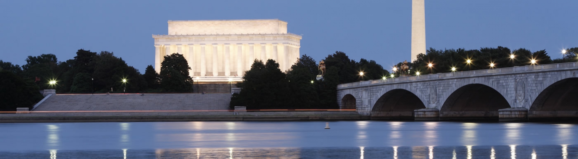 Monuments and Potomac River at night