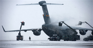 Airmen remove snow and ice from a C-17 Globemaster III March 25, 2013, at Joint Base Andrews, Md. Three to five inches of snow fell at Andrews, marking the first major snowstorm of the year in the area. The C-17 is assigned to assigned to Joint Base Charleston, S.C. (U.S. Air Force photo/Staff Sgt. Perry Aston)