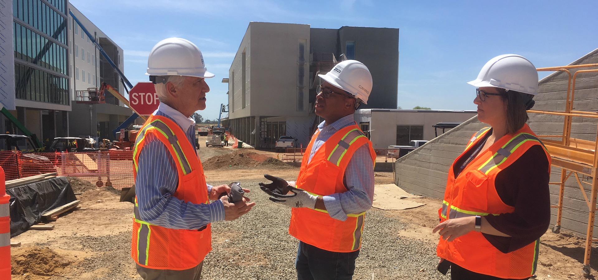 Rep. Costa speaking with people on a construction site