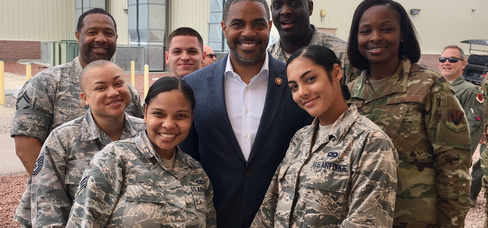 Rep. Horsford posing with members of the military