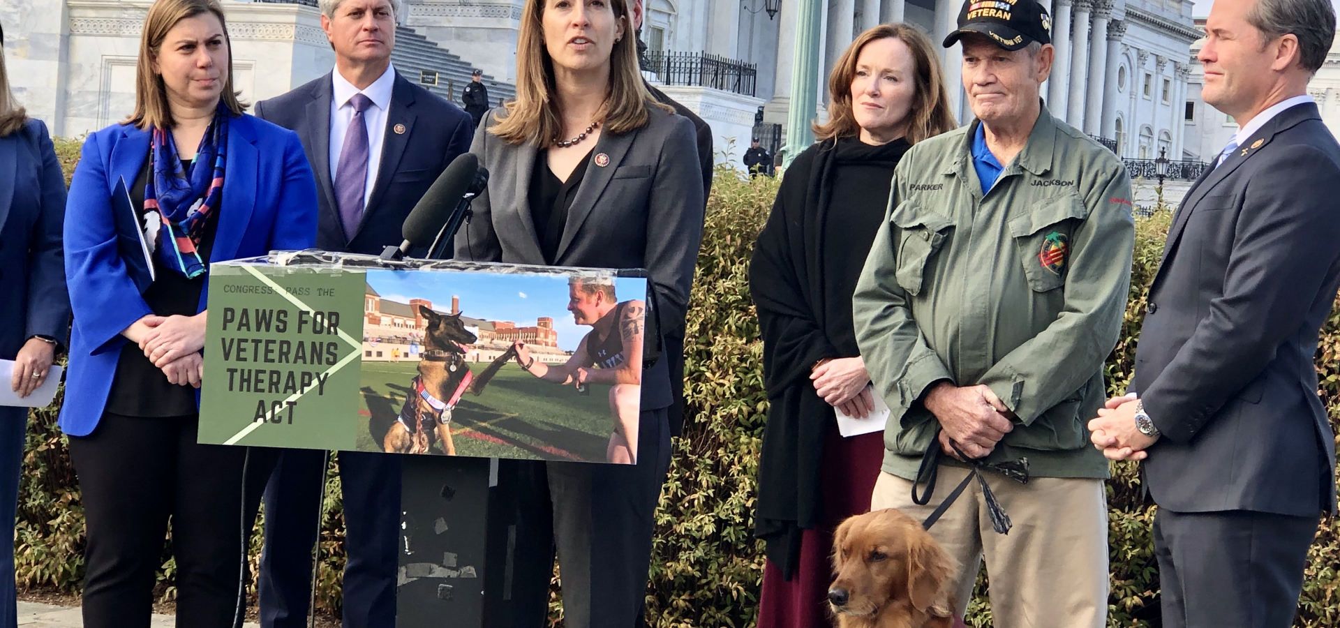 Rep. Sherrill speaks at a press conference with Vietnam Veteran Walter Parker and his service dog, Jackson, at the Capitol last year