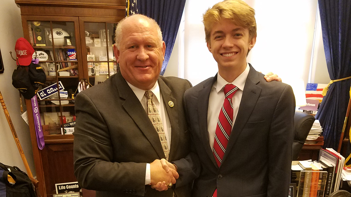 Congressman Thompson shaking hands with a young man in his office