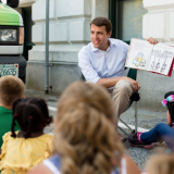Chris reads to children at the Manchester Public Library