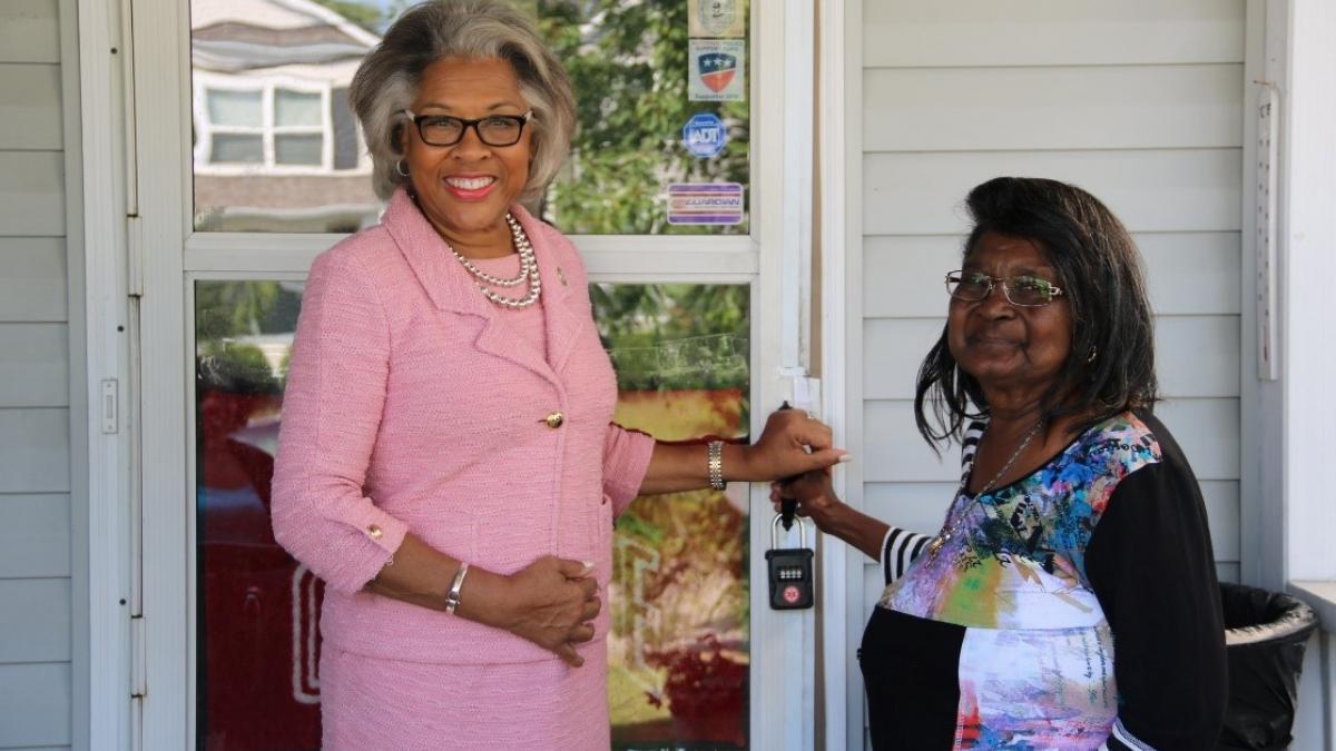 Congresswoman Beatty stands with a new homeowner.