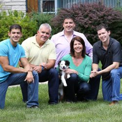 Cheri is a proud mother and grandmother. Here she is pictured with her husband, Gerry Bustos, and her three sons.