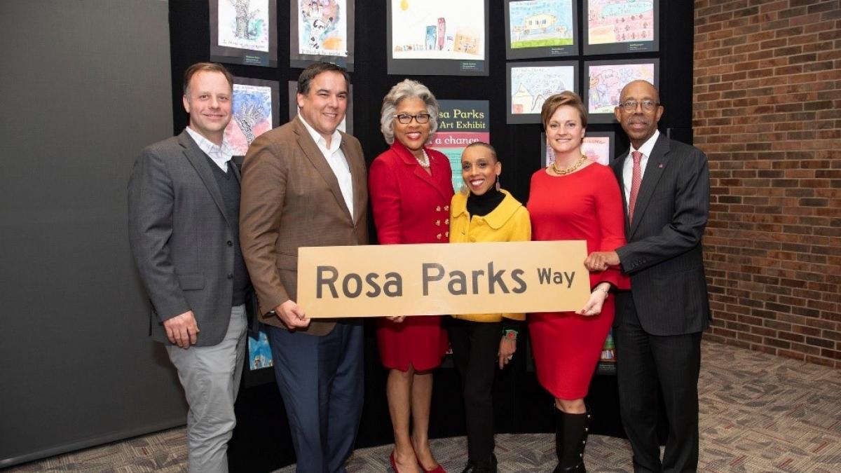 Congresswoman Beatty stands with "Rosa Parks Way" sign.