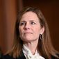 Judge Amy Coney Barrett, President Donald Trump&#39;s nominee for the U.S. Supreme Court, meets with Sen. Kevin Cramer, R-N.D., on Capitol Hill in Washington, Thursday, Oct. 1, 2020. (Erin Scott/Pool via AP) ** FILE **