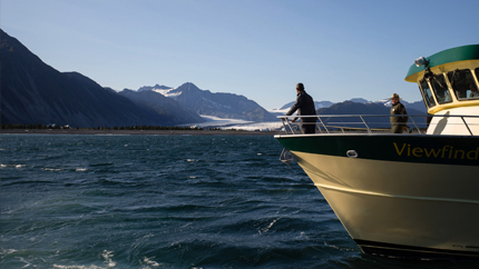 President Obama looks over a rapidly melting glacier in Alaska to bring awareness to the impacts of climate change