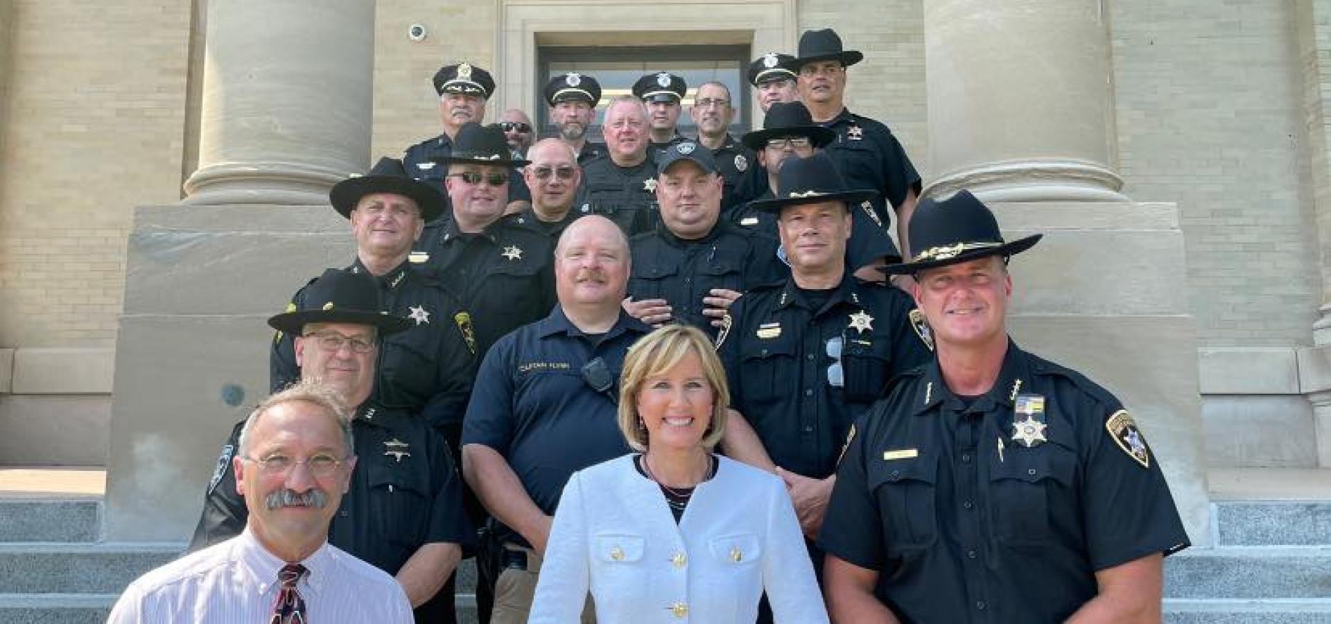 Tenney Poses for Photo with Law Enforcement Officers