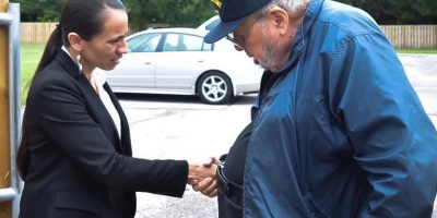 Representative Sharice Davids shaking hands with a constituent