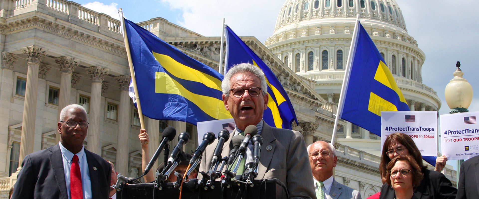 Rep. Lowenthal speaking at the podium in front of the Capitol