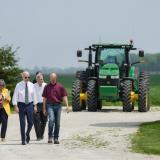 Rep. Kelly and President Biden walk on a farm in Kankakee, Illinois 