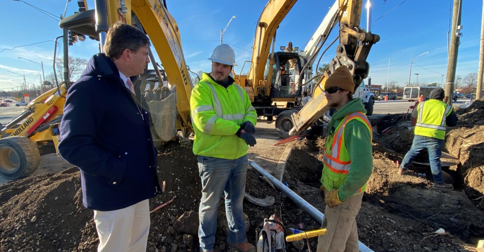 Rep. Schneider with infrastructure workers