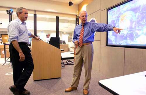 President Bush gets the lowdown on the path of Hurricane Jeanne last month from NOAA National Hurricane Center director Max Mayfield. The President came to the hurricane weary state to observe recovery efforts from the storm.
