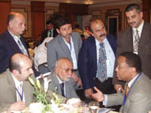 Photo of Assistant Secretary Lash with Iraqi businessmen at the Iraqi Arab Alliance conference in Bahrain.