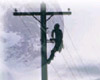 image of telephone repairman on telephone pole