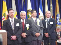 This is a photograph of Pictured from left to right: Michael E. Sargeant, William D. Barron, Tony Cordova, and Douglas A. Schreurs