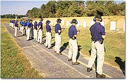 Photograph of Special Agents in training at the firing range.