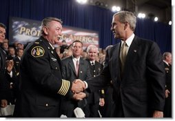 President George W. Bush greets firemen after remarks on homeland security at Northeastern Illinois Public Training Academy in Glenview, Illinois on Thursday July 22, 2004. White House photo by Paul Morse.