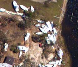 NOAA aerial image of boats tossed inland and homes damaged in Pensacola, Fla.
