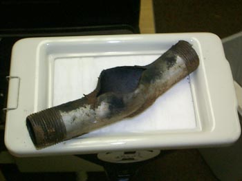 Figure 1 is a photograph of a black powder explosive.