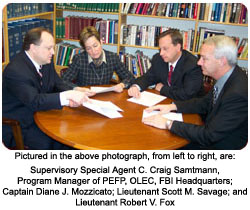 Pictured in the above photograph, from left to right, are: Supervisory Special Agent C. Craig Samtmann, Program Manager of PEFP, OLEC, FBI Headquarters; Captain Diane J. Mozzicato; Lieutenant Scott M. Savage; and Lieutenant Robert V. Fox.