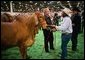 President George W. Bush greets a participant at the Houston Livestock Show and Rodeo Monday, March 8, 2004. White House photo by Eric Draper.