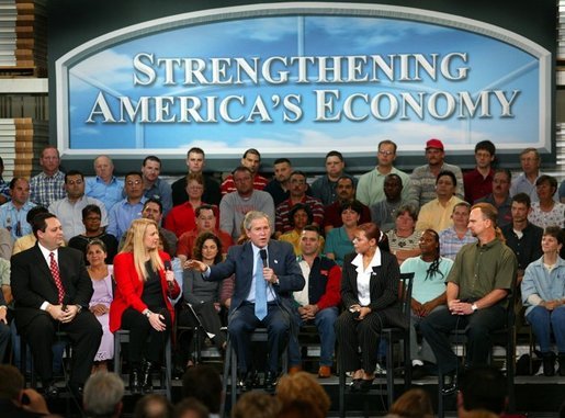 President George W. Bush leads the on stage discussion during a conversation on the economy with employees at Nu-Air Manufacturing Company in Tampa, Florida, Monday, Feb. 16, 2004. White House photo by Eric Draper.